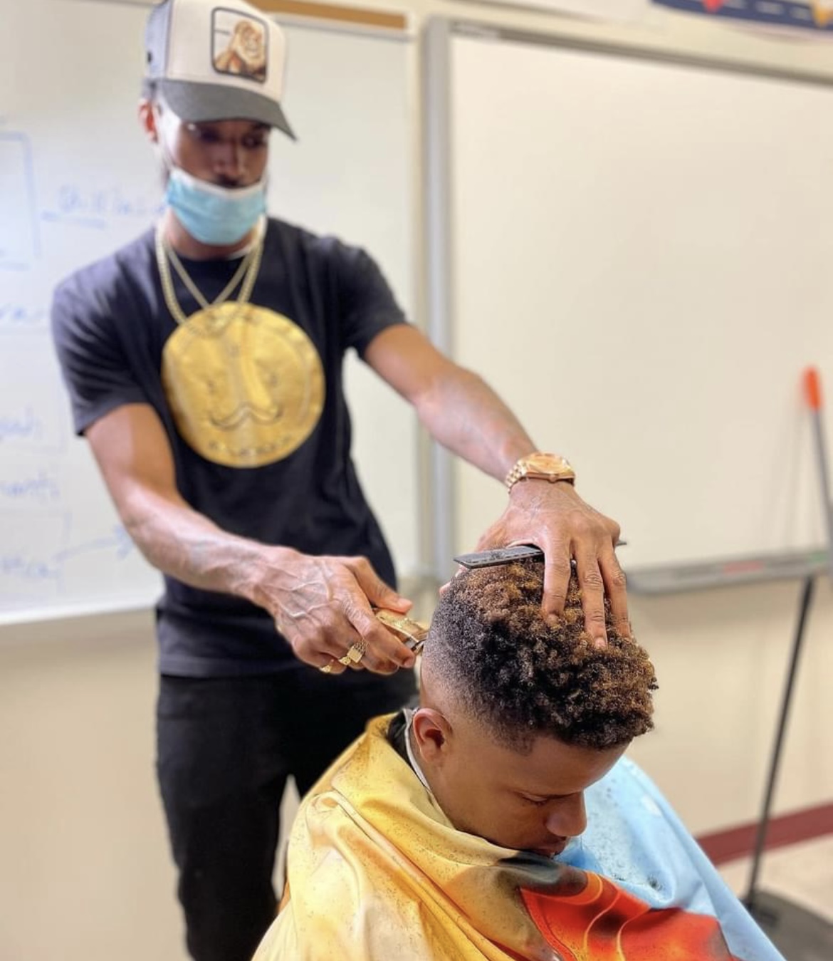 Carver students receiving free haircuts by the 2nd chance works program