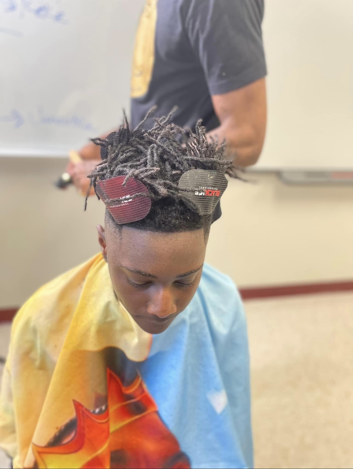 Carver students receiving free haircuts by the 2nd chance works program